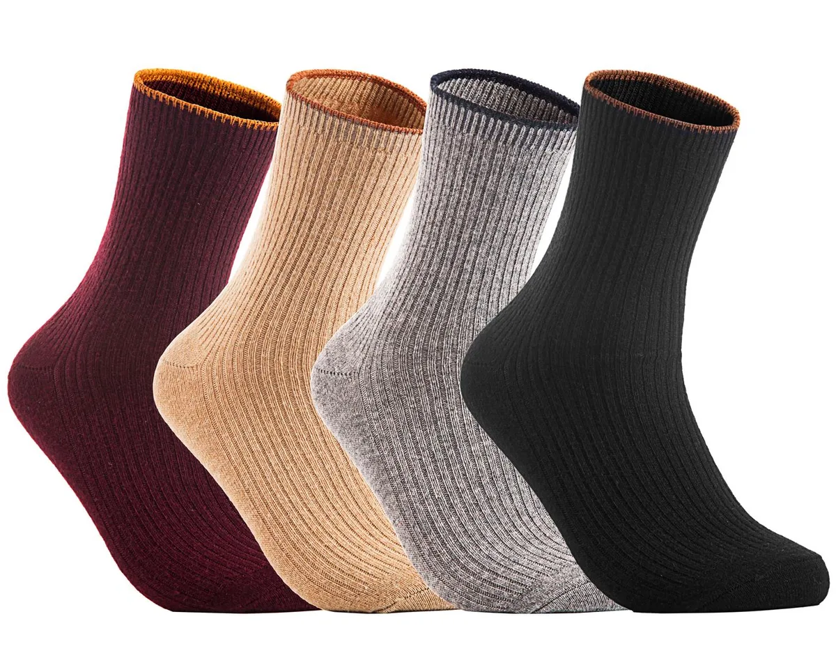 Four pairs of wool crew socks in assorted colours, folded flat