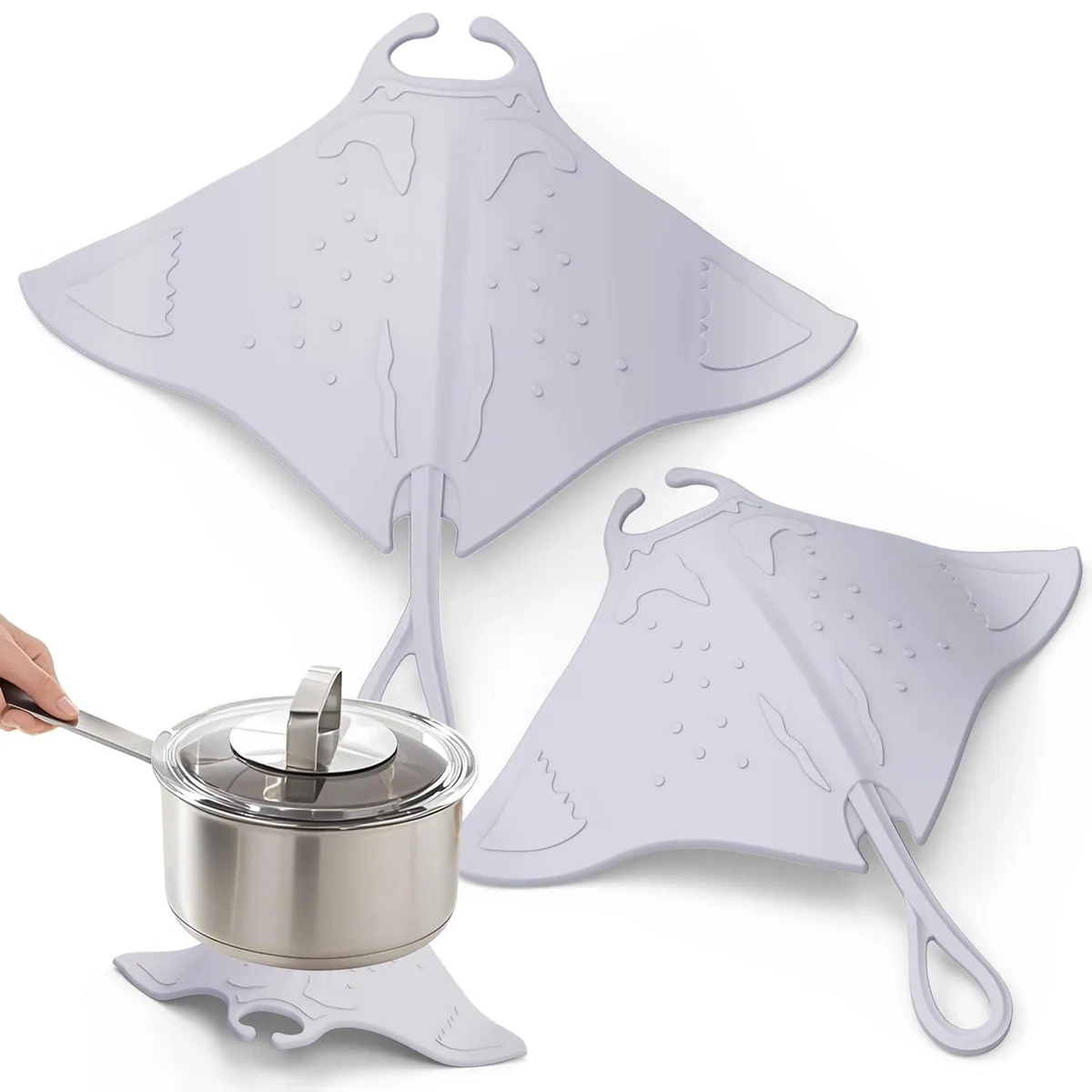 Two grey silicone manta-ray trivets with curved tails, textured surface, flexible raised wings
