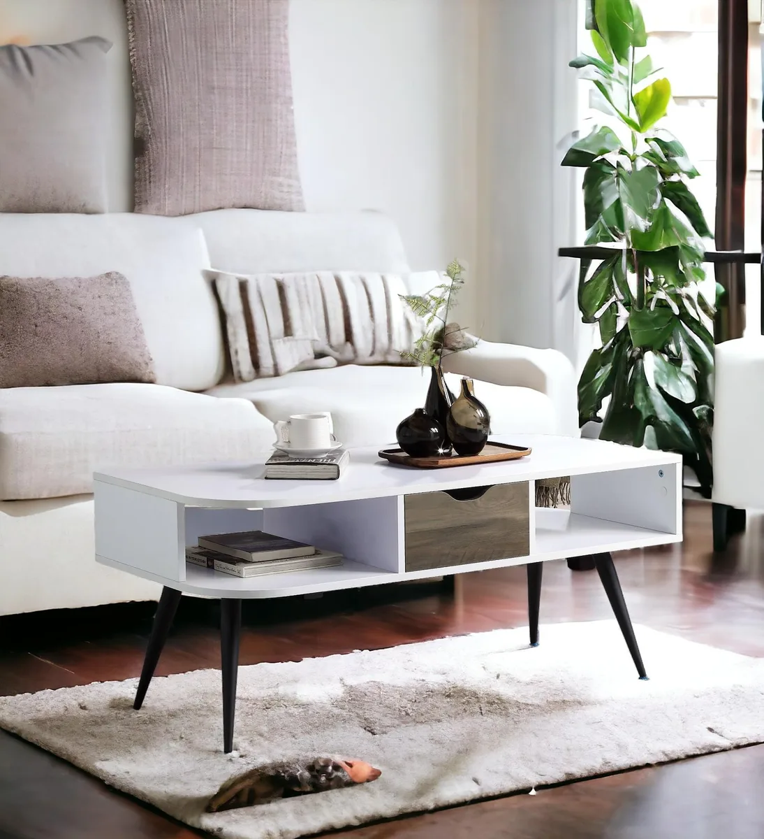 Rectangular coffee table in white and black with metal legs, one drawer and two open shelves
