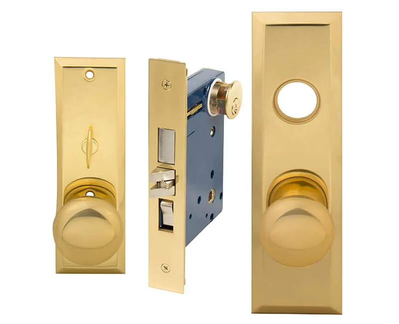 Polished brass mortise entry lockset with screwless knobs and wide faceplate