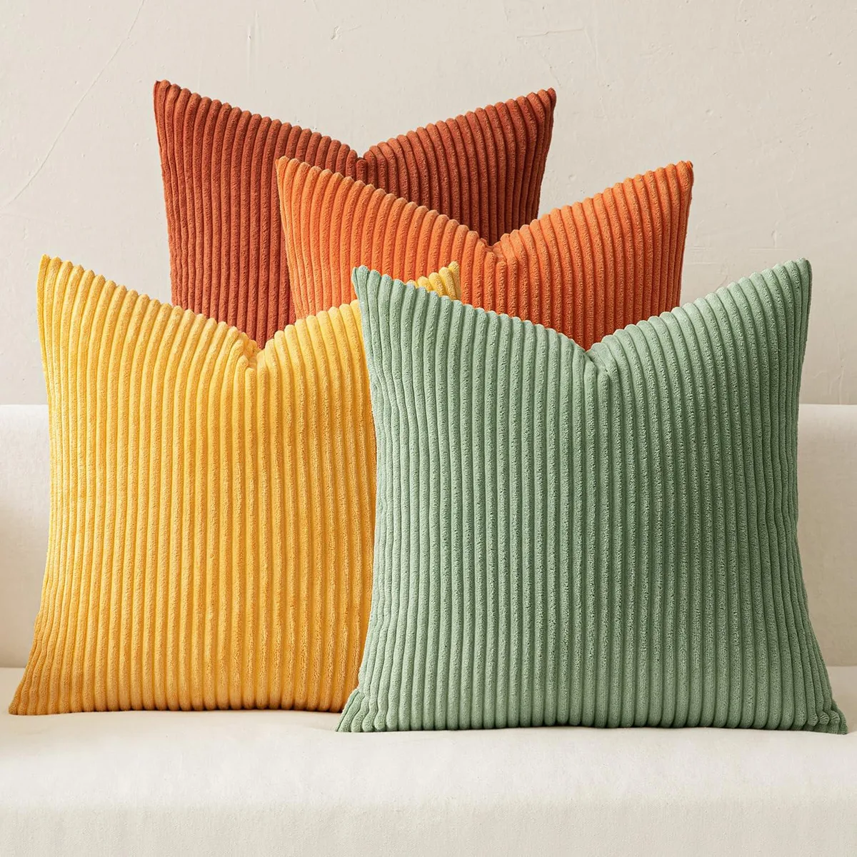 Four square corduroy pillow covers in green and rust-green, 18 by 18 inches