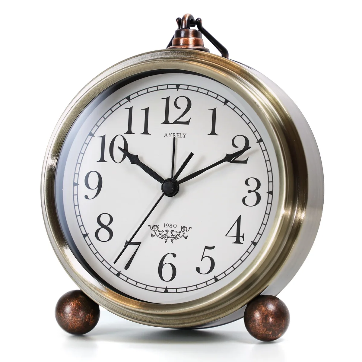 Round gold metal vintage analog alarm clock with hanging ring and feet