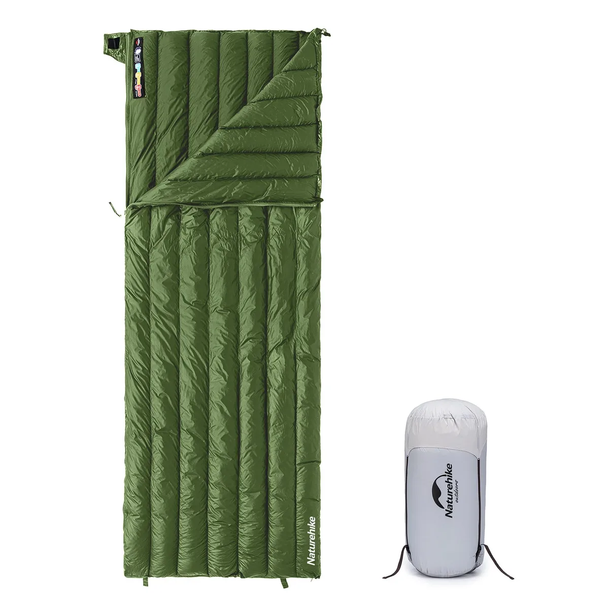 Compact green rectangular down sleeping bag in stuff sack, short size, lightweight nylon shell, YKK zipper visible