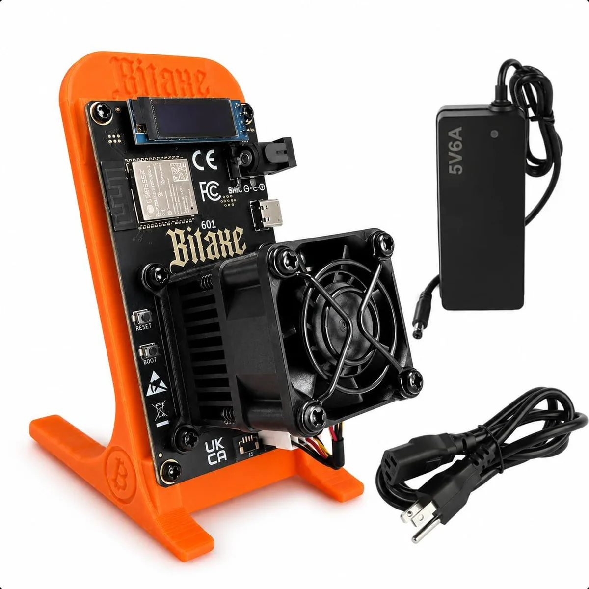 Orange Bitaxe 601 solo miner on 3D printed stand with OLED display and cooling fan