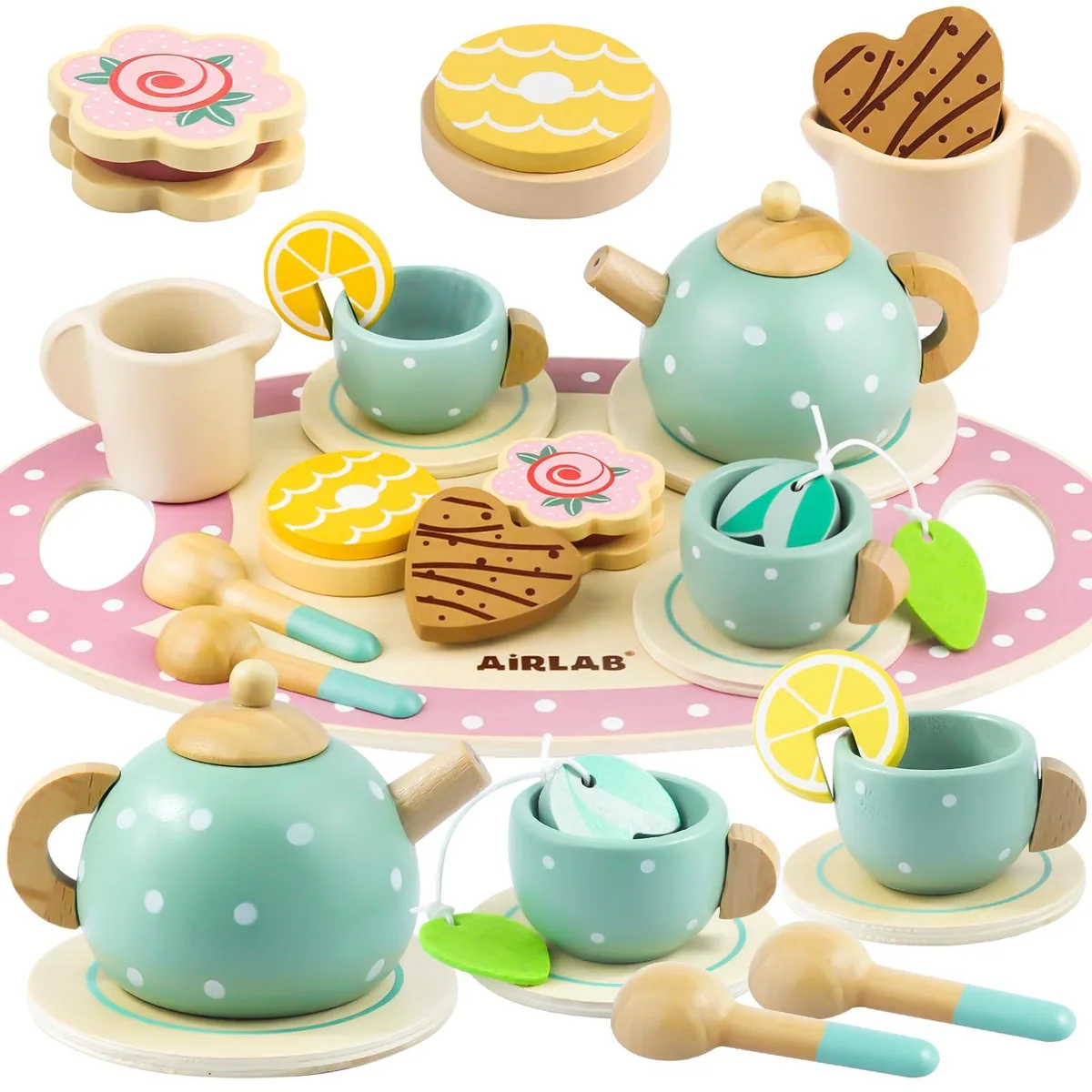 Wooden tea set with teapot, cups, plates, food pieces and tray on natural wood finish