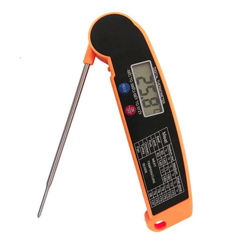 Black and orange digital thermometer with folding metal probe and LCD screen