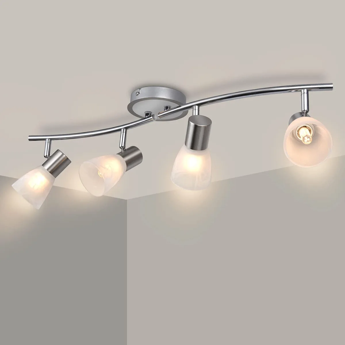 Chrome-finish four-light track kit with milky white glass shades on a linear bar