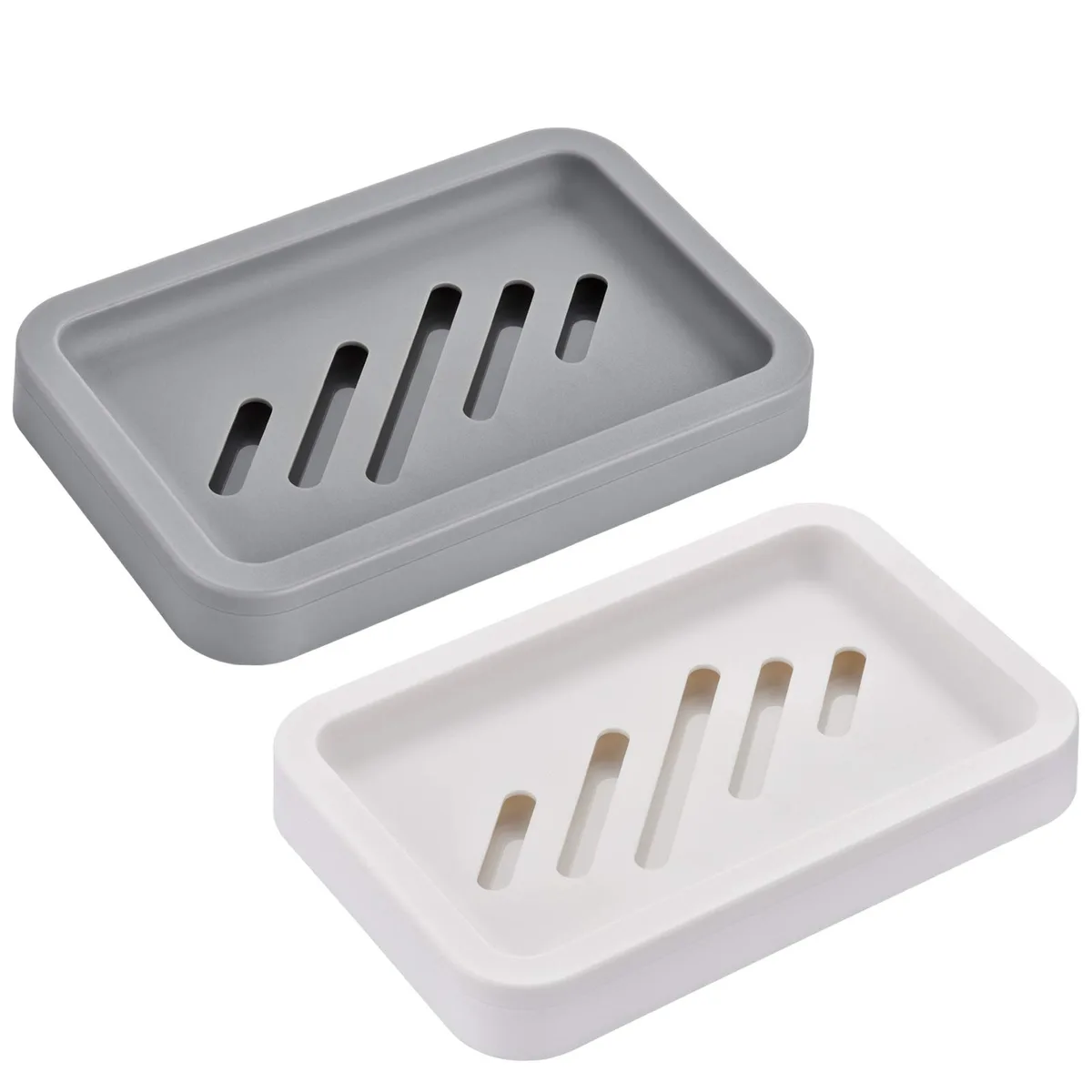 Two plastic soap dishes, white and grey, upper and lower parts for drainage