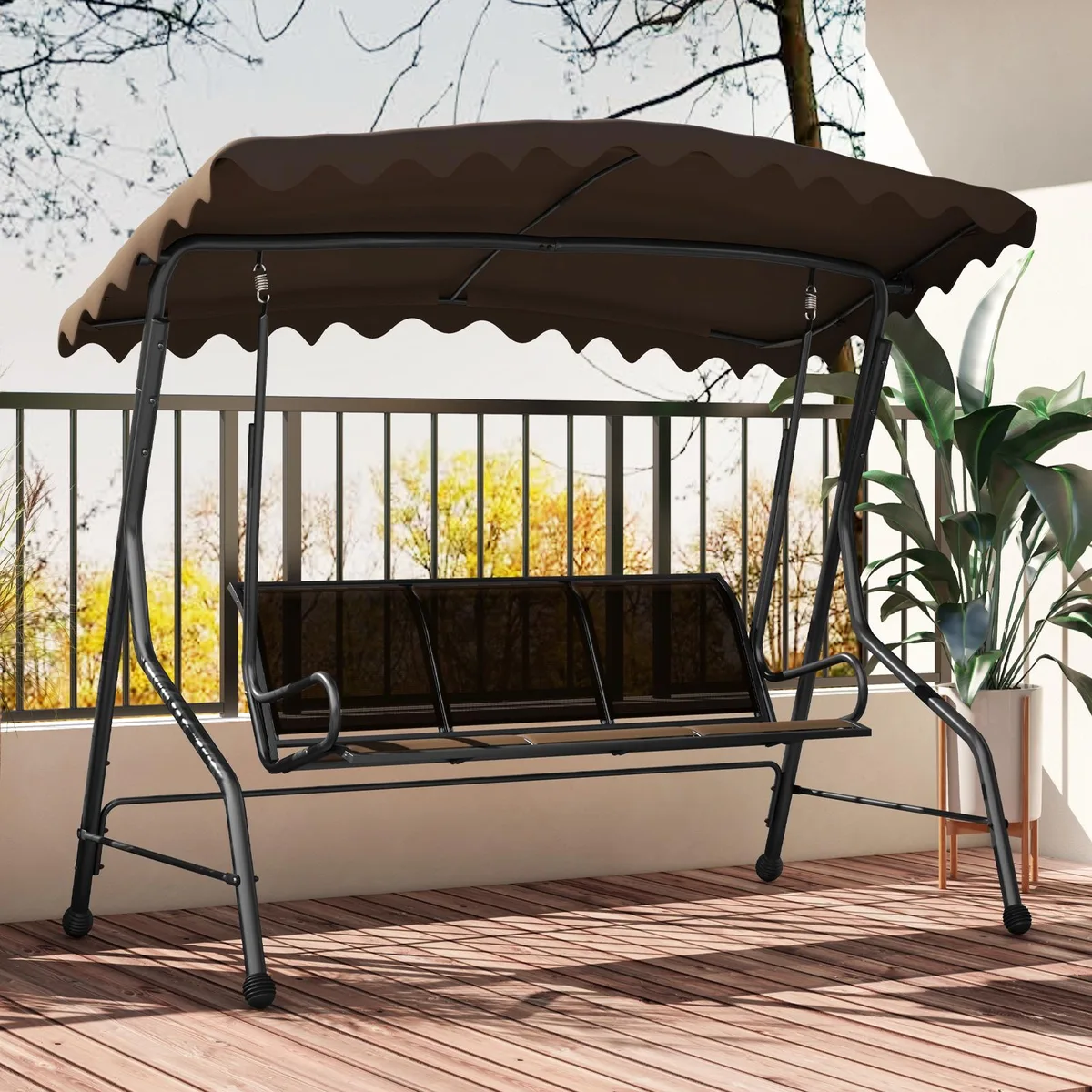 Brown three-seat porch swing with metal frame, adjustable canopy, and woven fabric seats