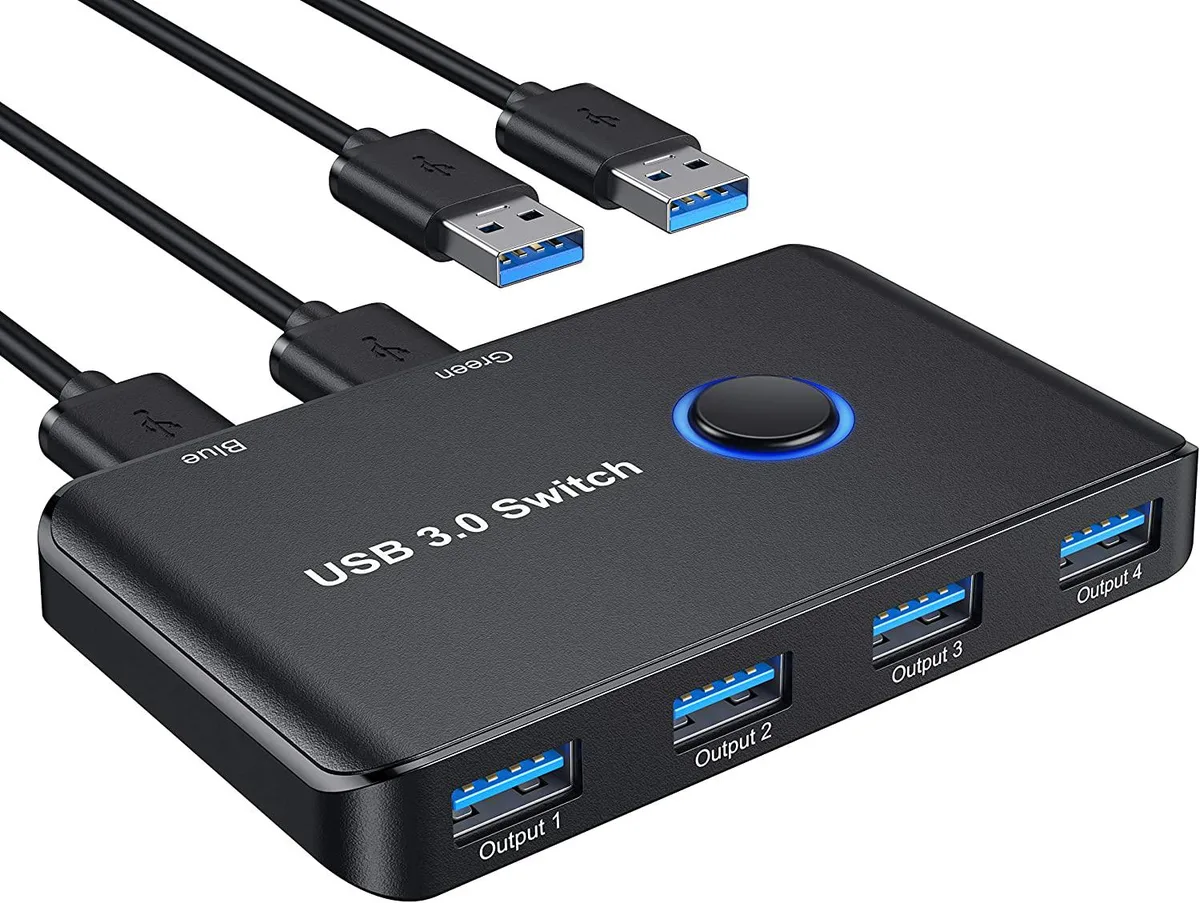 Small black rectangular box with a front button and four USB ports