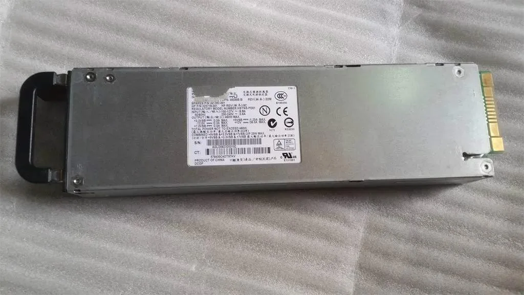 Rectangular silver server power supply unit with rear vent grille and power socket