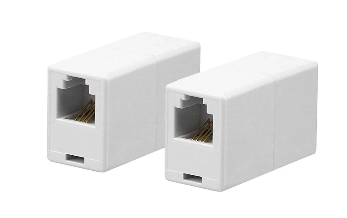 Two small white plastic inline telephone couplers side by side