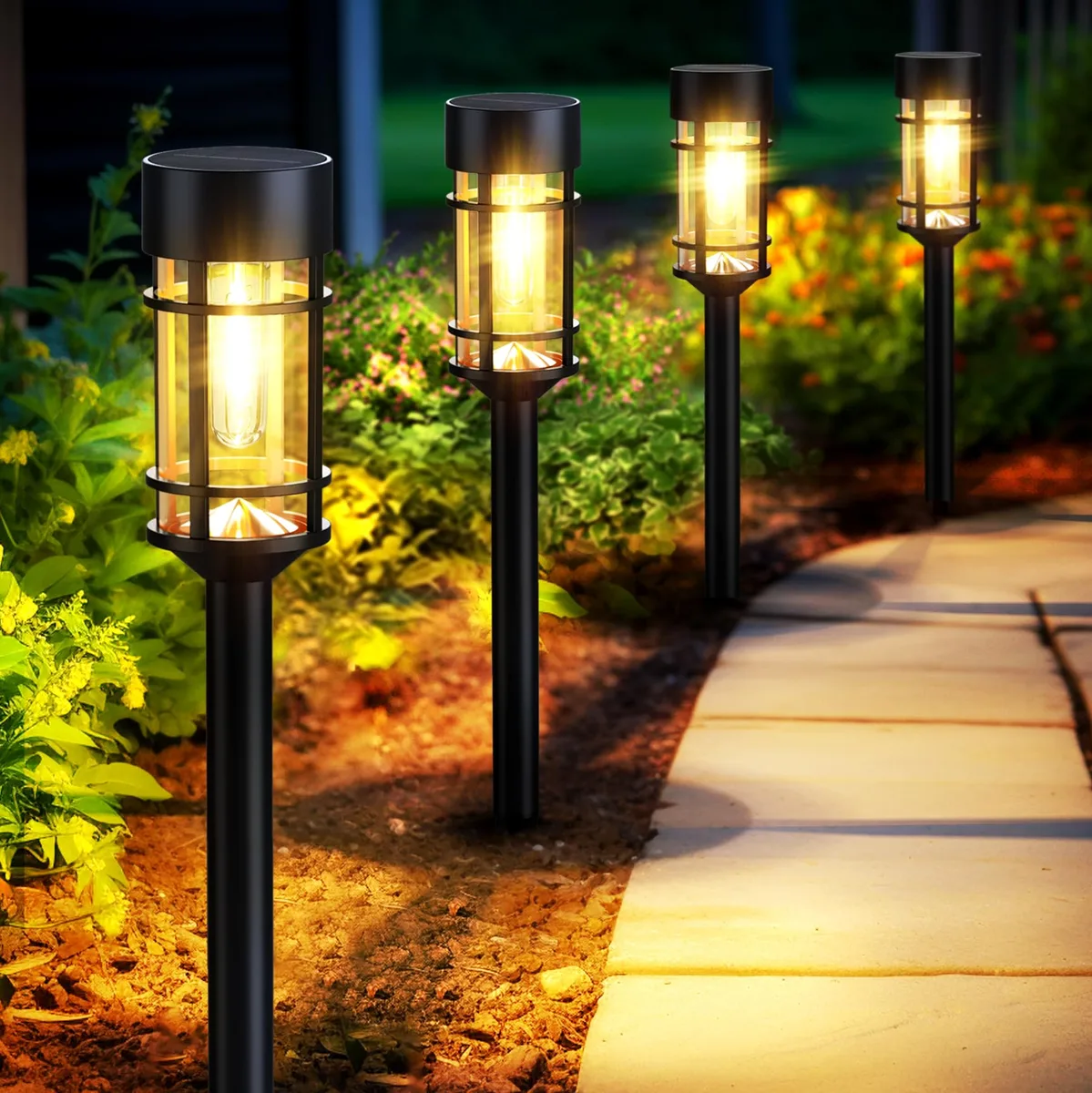 Twelve polished chrome solar path lights with glass shades on stainless steel poles