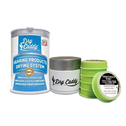 A cylindrical container with a small jar and desiccant discs inside