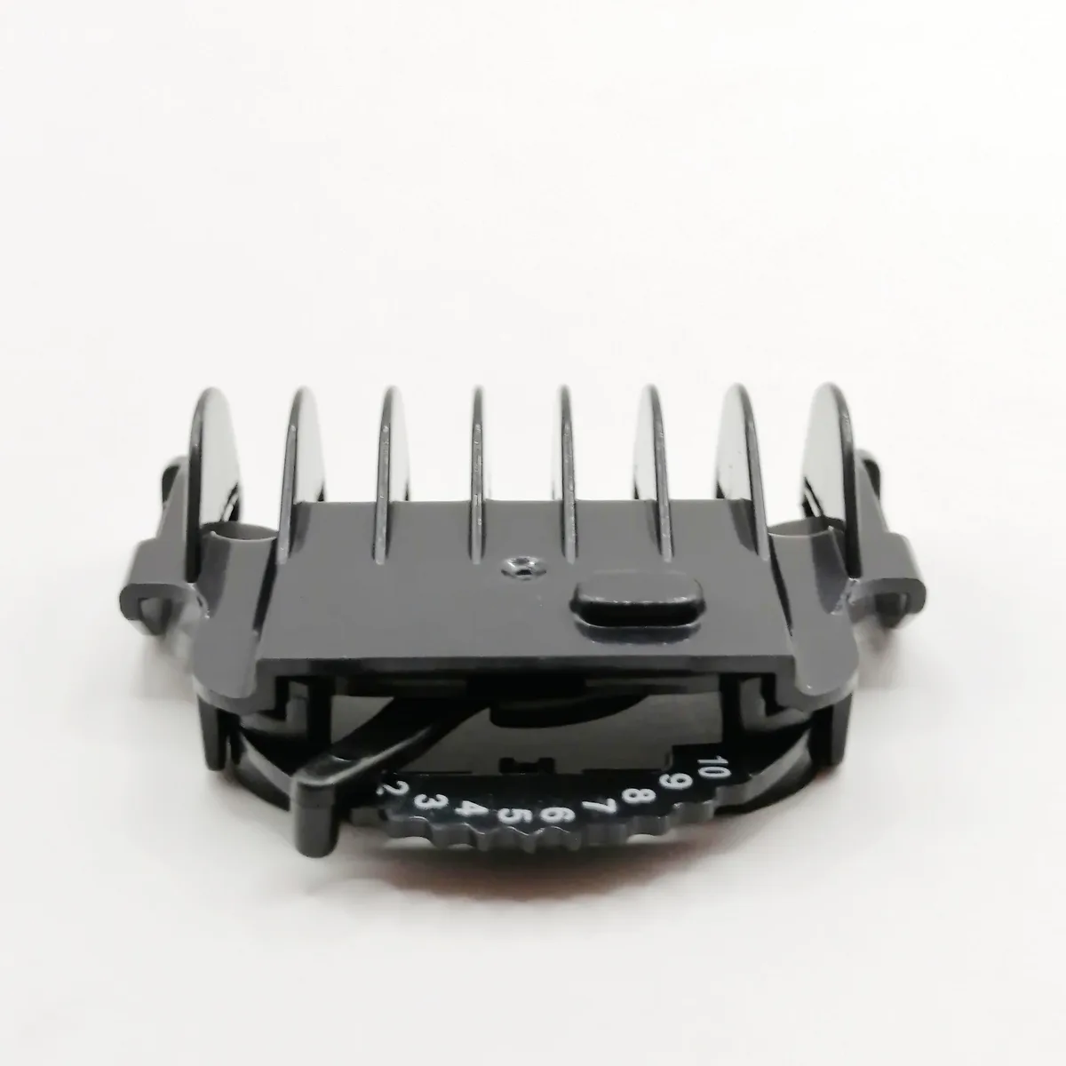 Black plastic guide comb with ten length settings from 2 to 11 mm