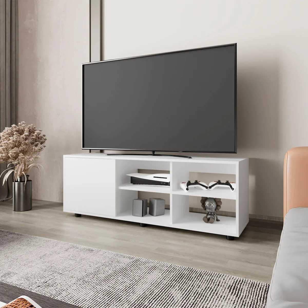 White particle-board TV stand with one door and open shelves