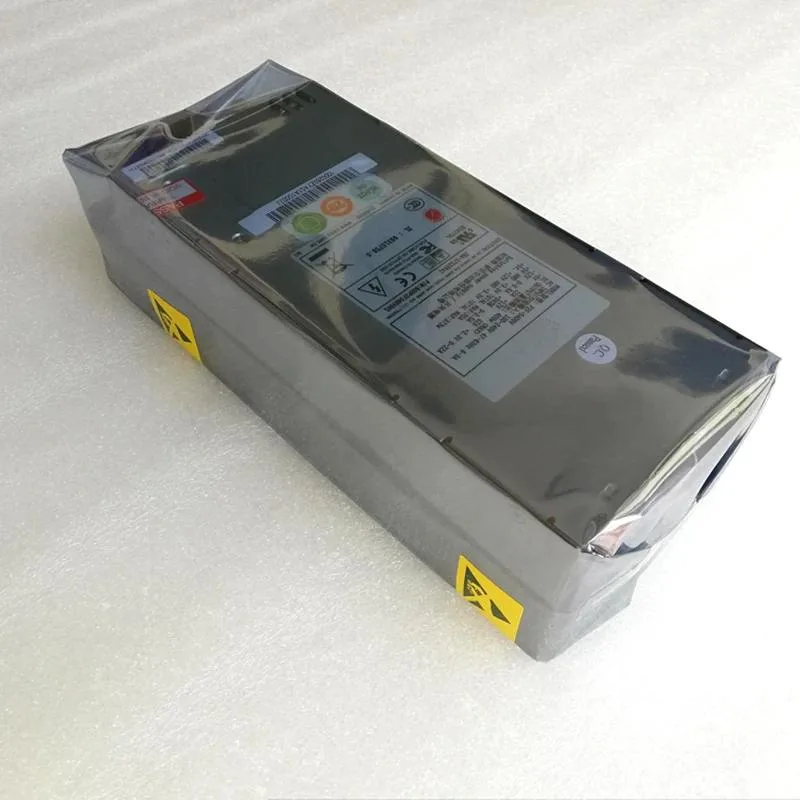 Rectangular silver ATX power supply unit with fan grille and cable bundle