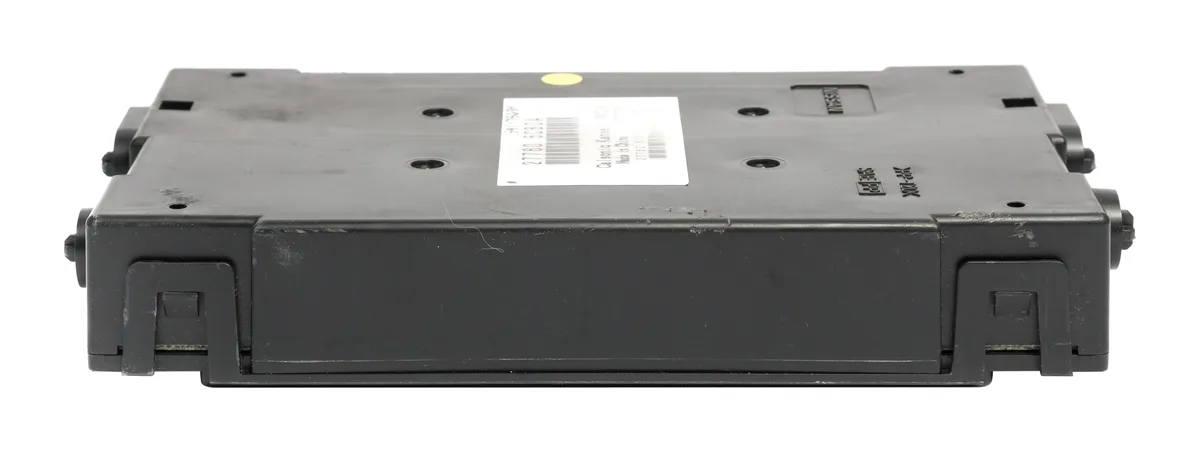 Rectangular automotive control module with silver metal casing and multi-pin connector