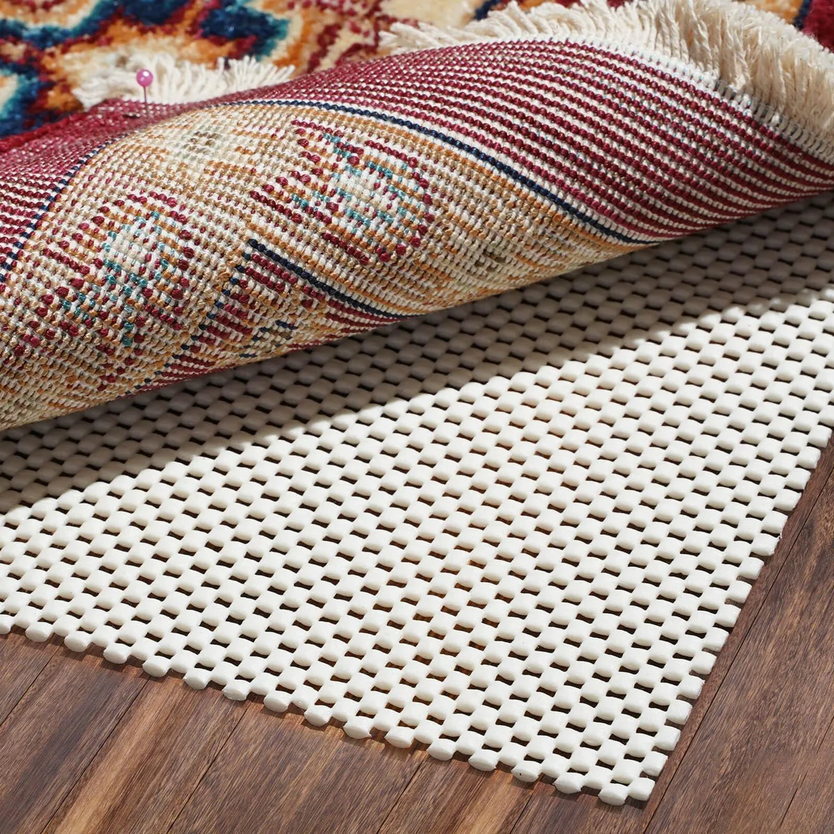 Ivory rectangular rug pad with open PVC grid, 2 by 3 feet