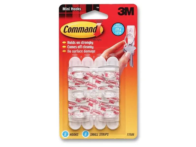 Six white mini hooks with adhesive strips on a backing card