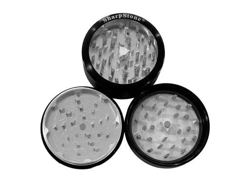 Black 2.5 inch herb grinder with clear top and aircraft-grade aluminium body