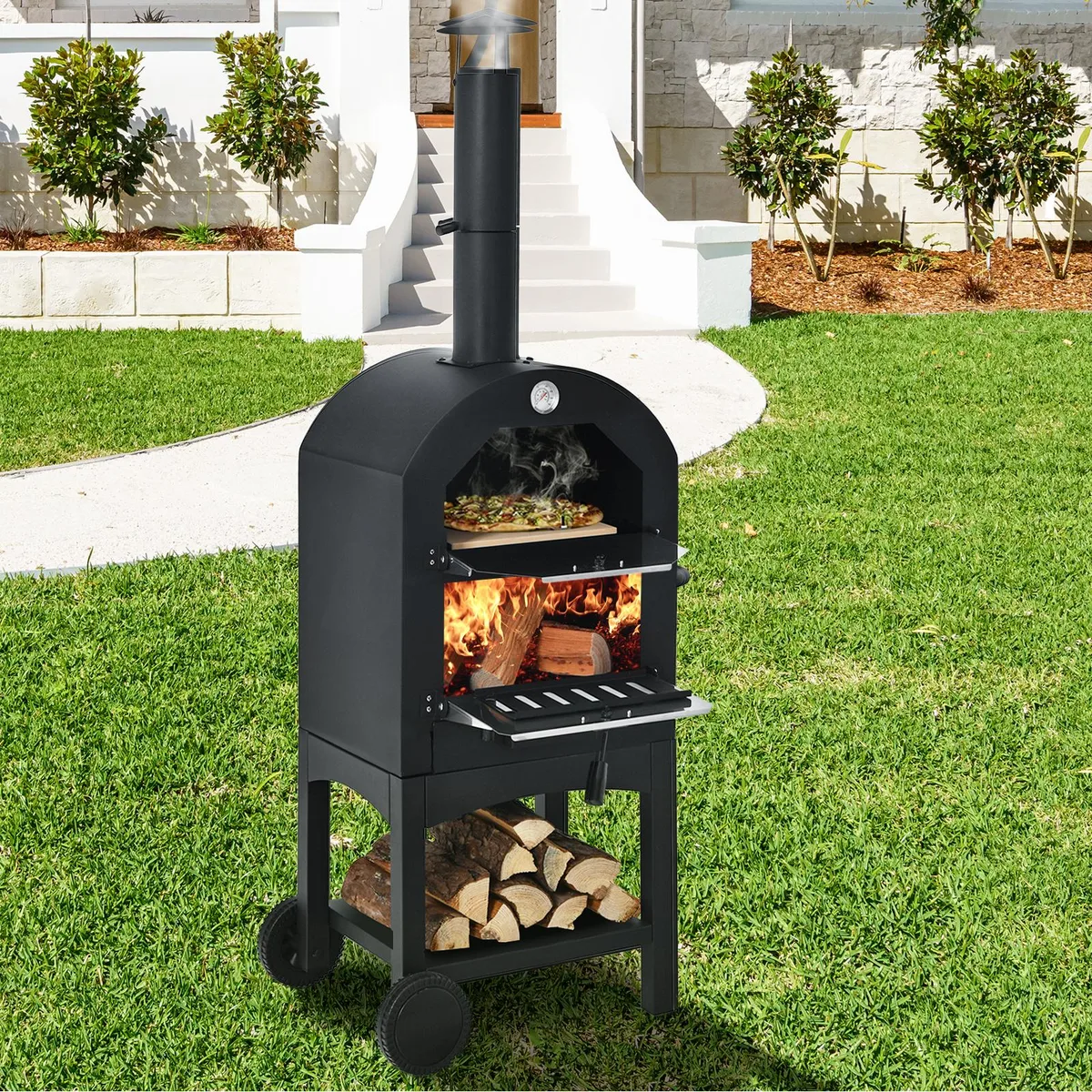 Black portable pizza oven on two wheels with chimney, stone and cover