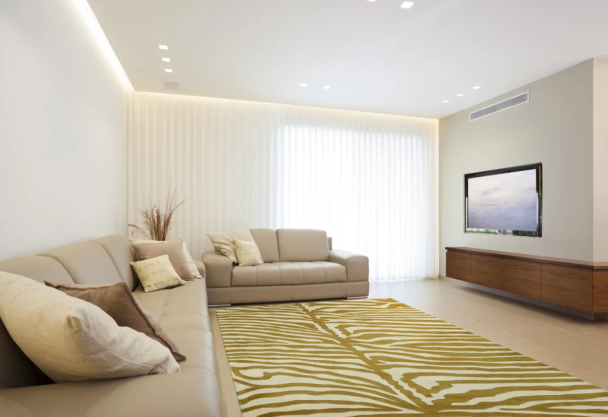 Hand-tufted wool rug in gold with transitional stripe pattern