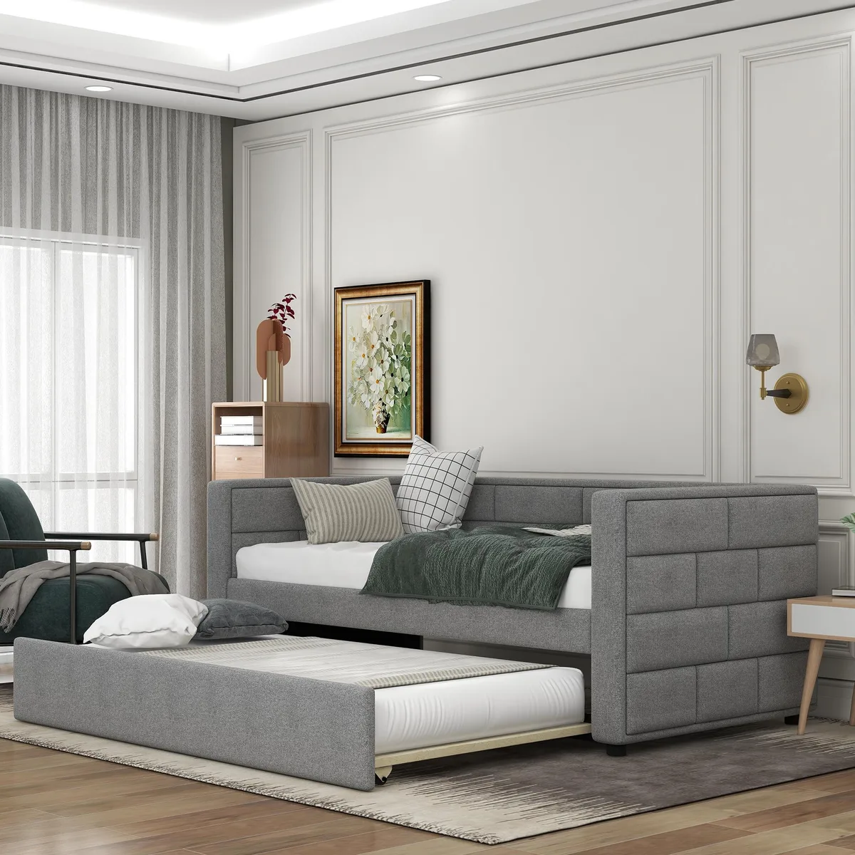 Gray fabric-upholstered twin daybed with padded back and trundle bed underneath