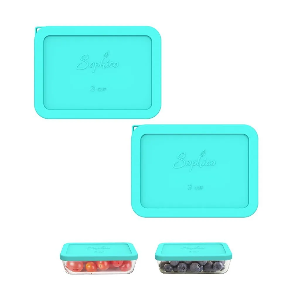 Two mint-green rectangular silicone lids with hanging holes, replacement covers for Pyrex 7210-PC bowls