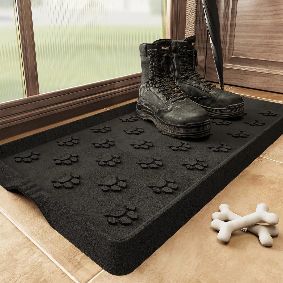 Black rubber boot tray with raised paw pattern and edges, rectangular shape, 16 by 27.5 inches