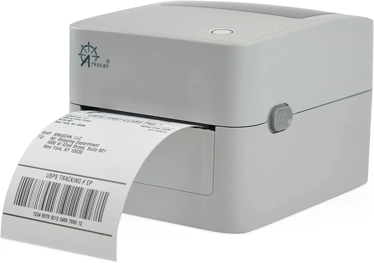 Compact white label printer with roll holder and fanfold slot