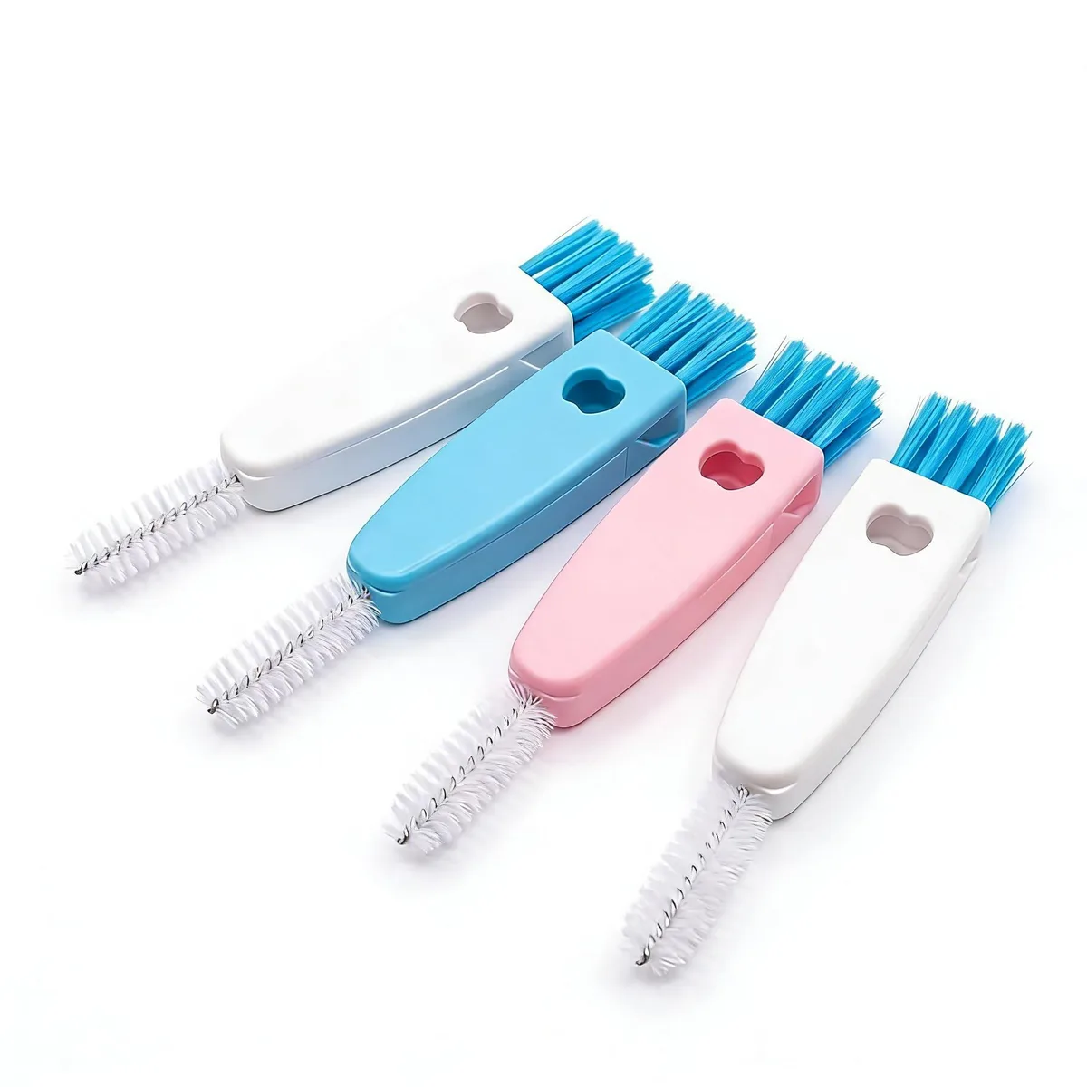 Four small brushes with white pink and blue handles each with three cleaning heads and a hanging hole