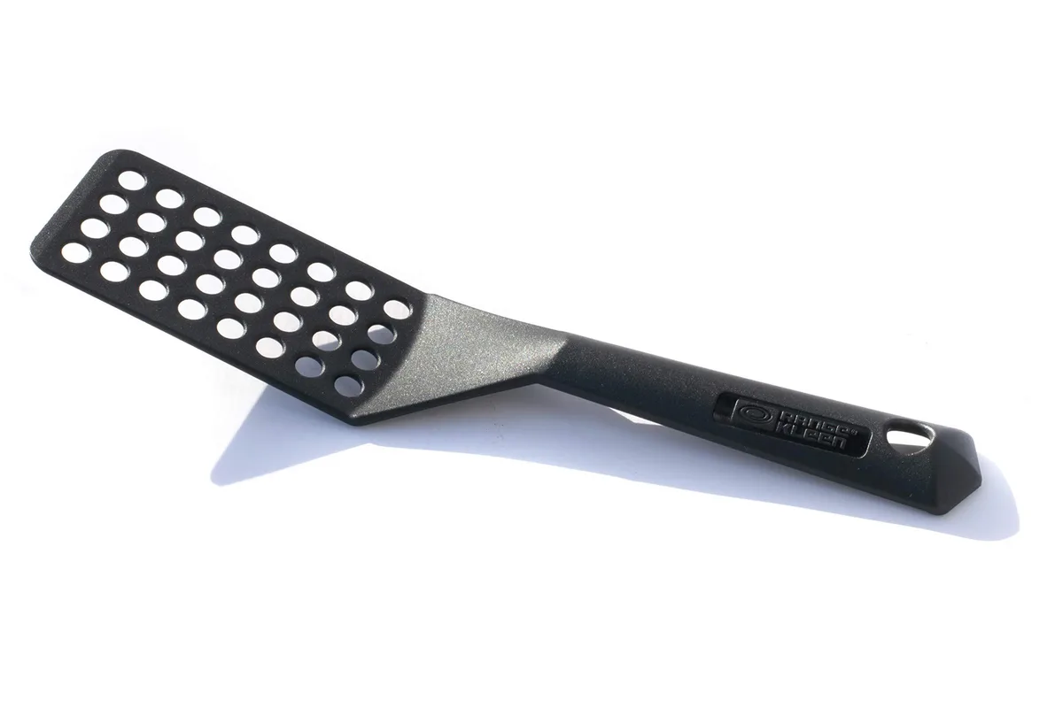Black nylon slotted turner, 10.5 by 2.5 inches, angled perforated head
