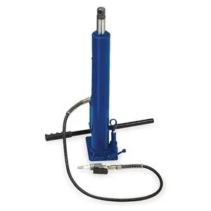 Red metal crane jack with tall vertical cylinder and wide base