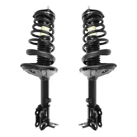 Two silver rear strut assemblies with coil springs and top mounts side by side