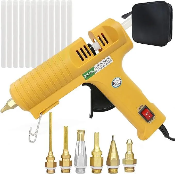 Yellow full-size hot glue gun with rubber grip, copper nozzle and twelve clear glue sticks