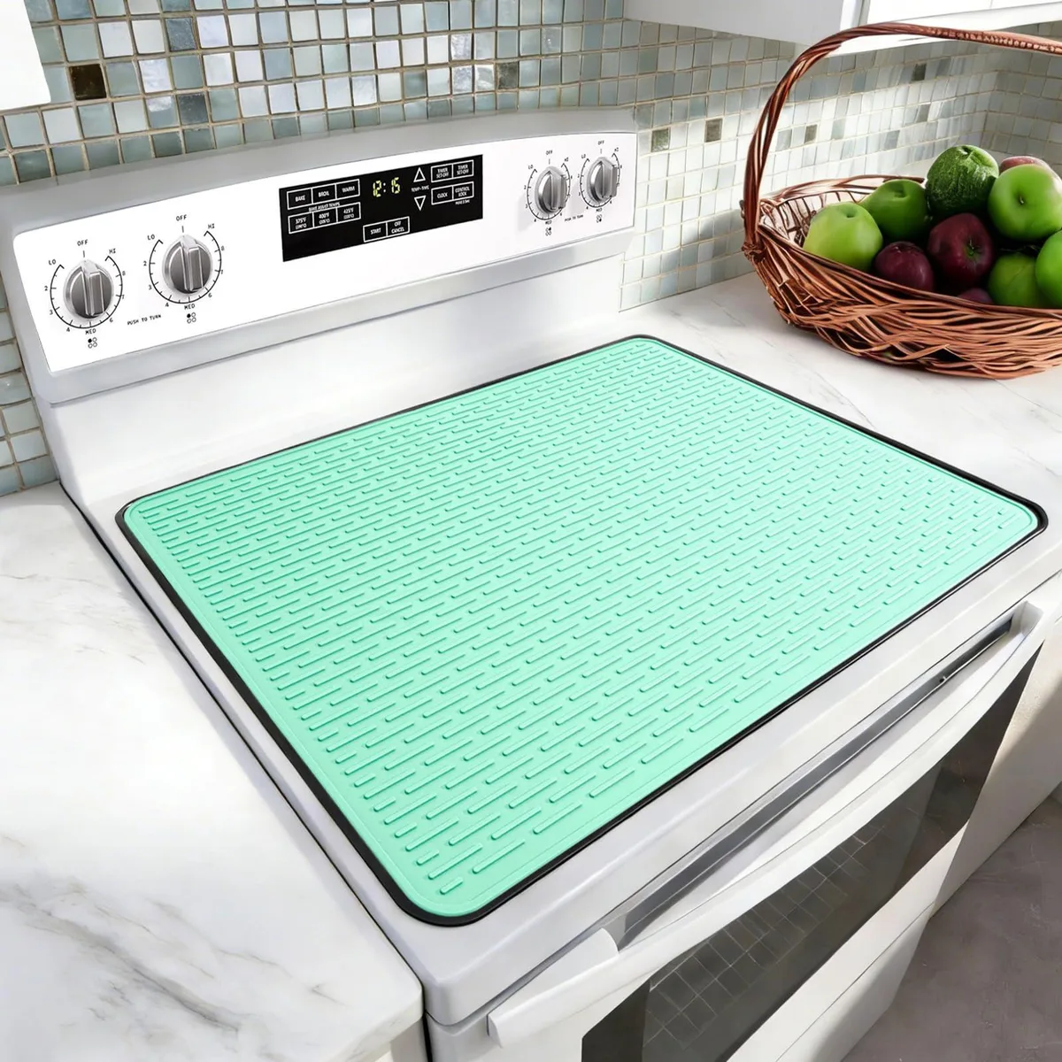 Aqua silicone stove cover with raised ridges and high edges, 28 by 20 inches