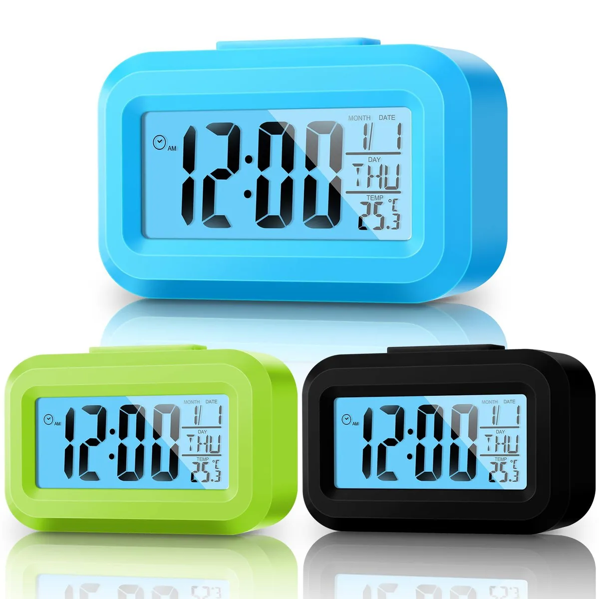 Three compact plastic digital alarm clocks in green, blue and black with large LCD screens