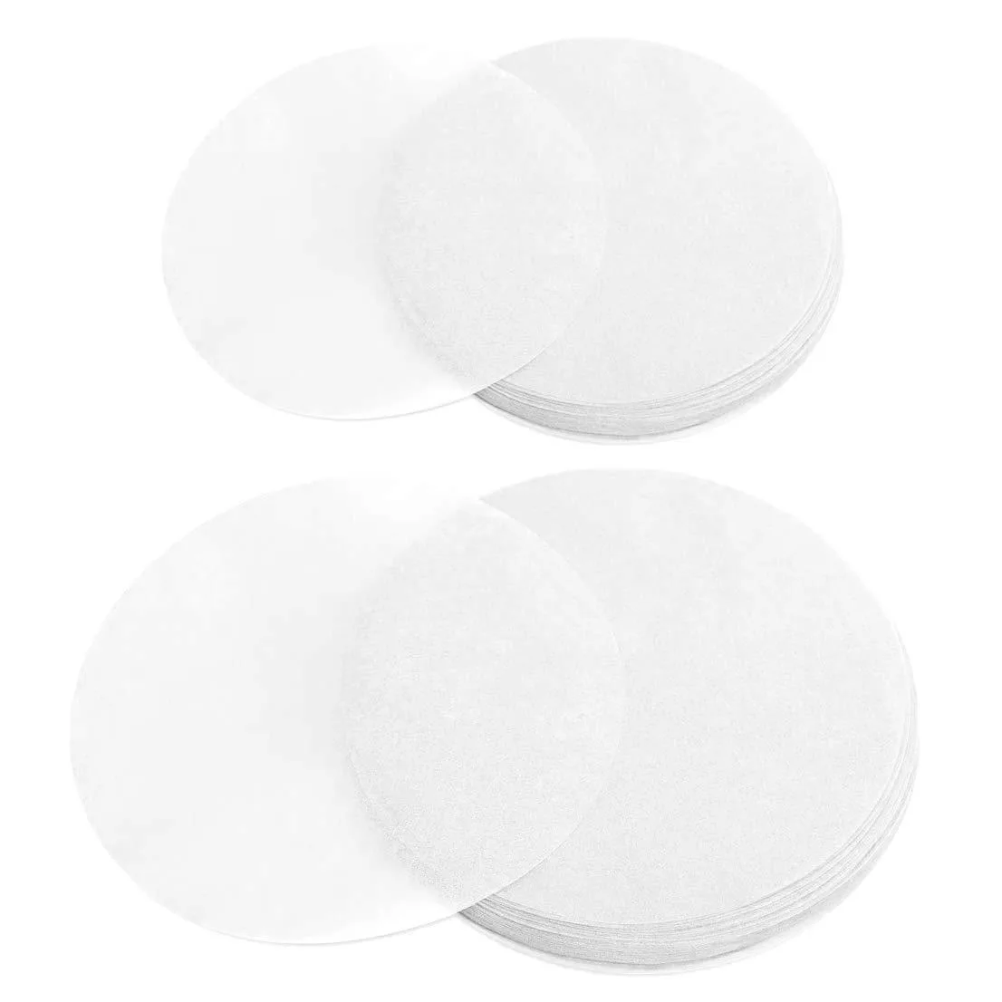 Stack of white parchment paper rounds in two sizes