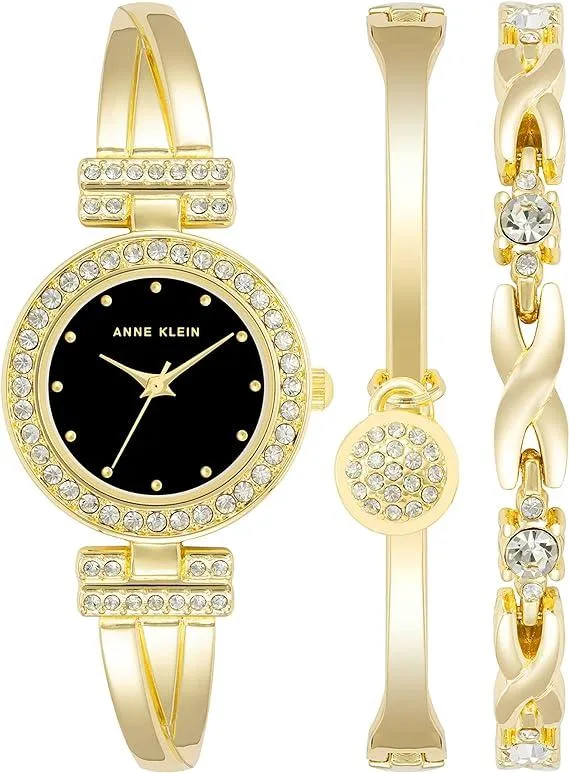 Gold-tone X-shaped bangle watch with 36 crystals on bezel, black dial, two matching crystal bracelets