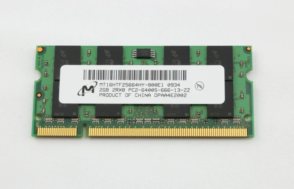 Green rectangular memory module with gold edge connectors