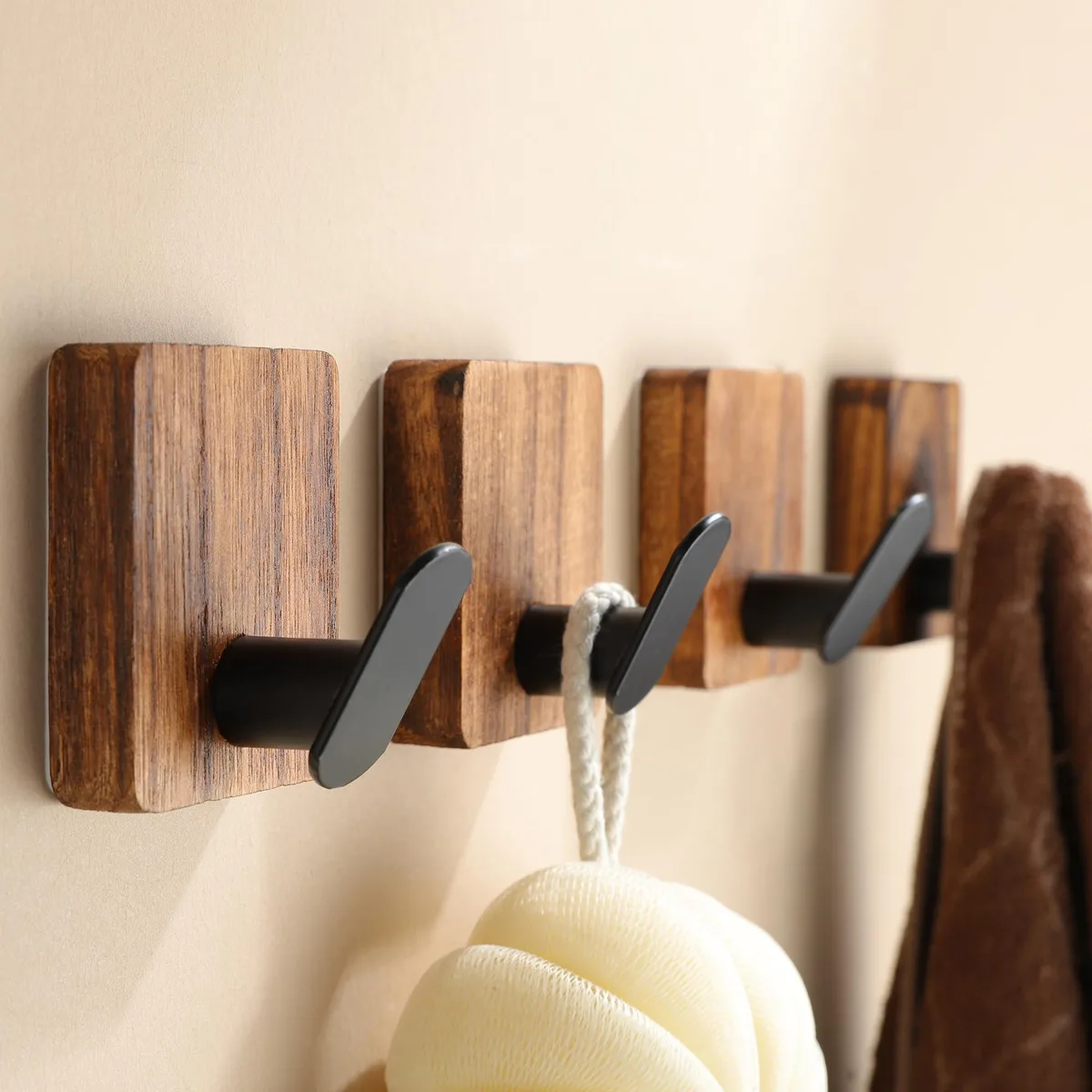 Four natural wood adhesive wall hooks in neutral brown farmhouse style