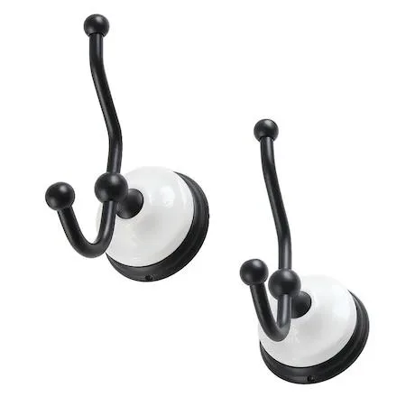 Two matte black Victorian robe hooks, wall-mounted storage