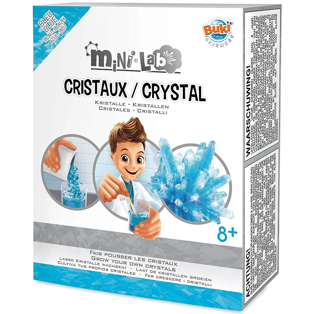 Colourful cardboard box showing crystal-growing kit with beaker and illustrated instructions