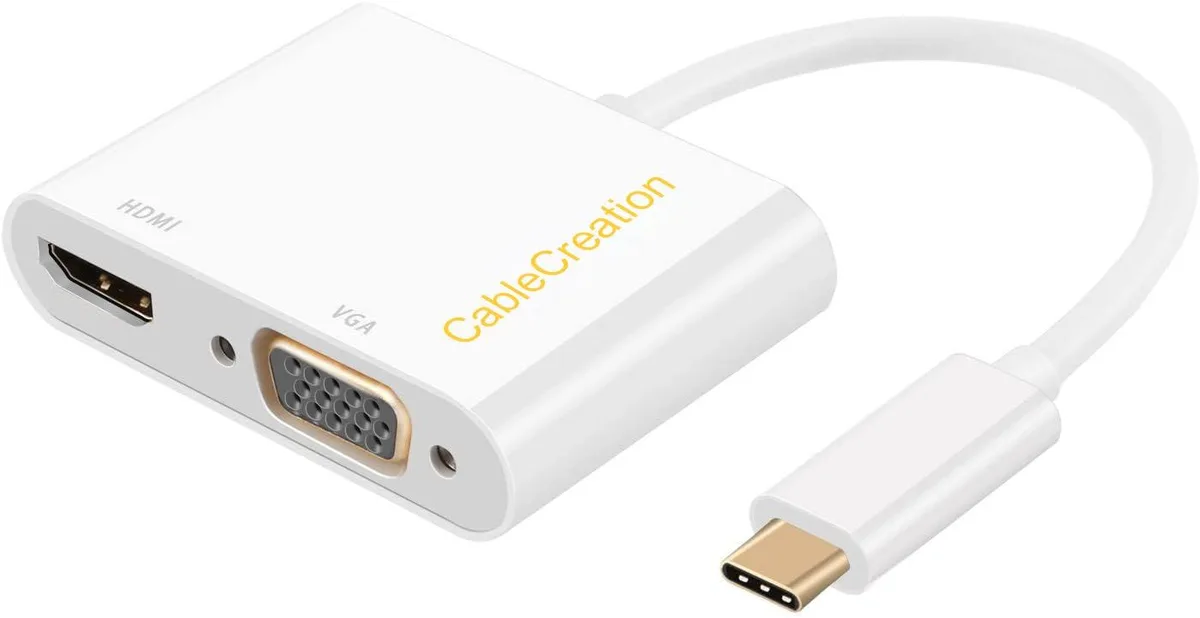 Two white USB-C adapters with HDMI and VGA ports