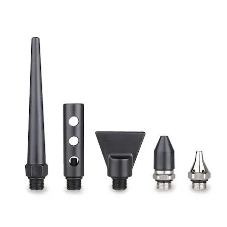 Five brass nozzles in assorted shapes on a light background