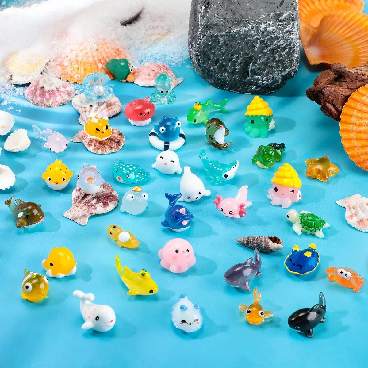 Thirty-six tiny resin sea creatures in assorted shapes and colours