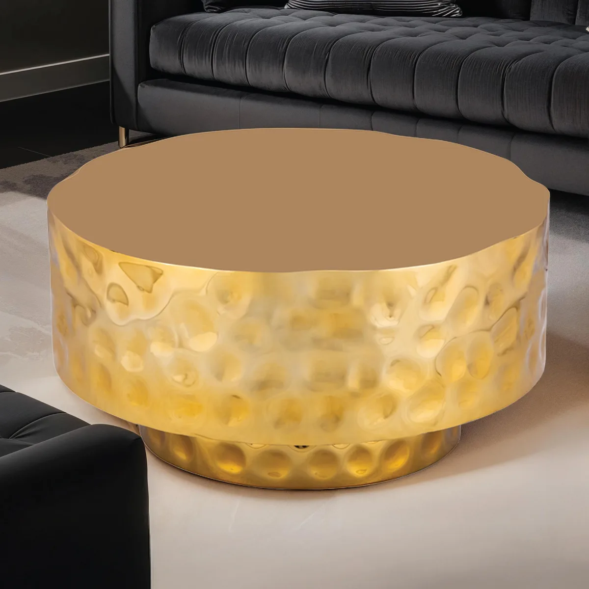 Round gold coffee table with hand-hammered textured steel top and base