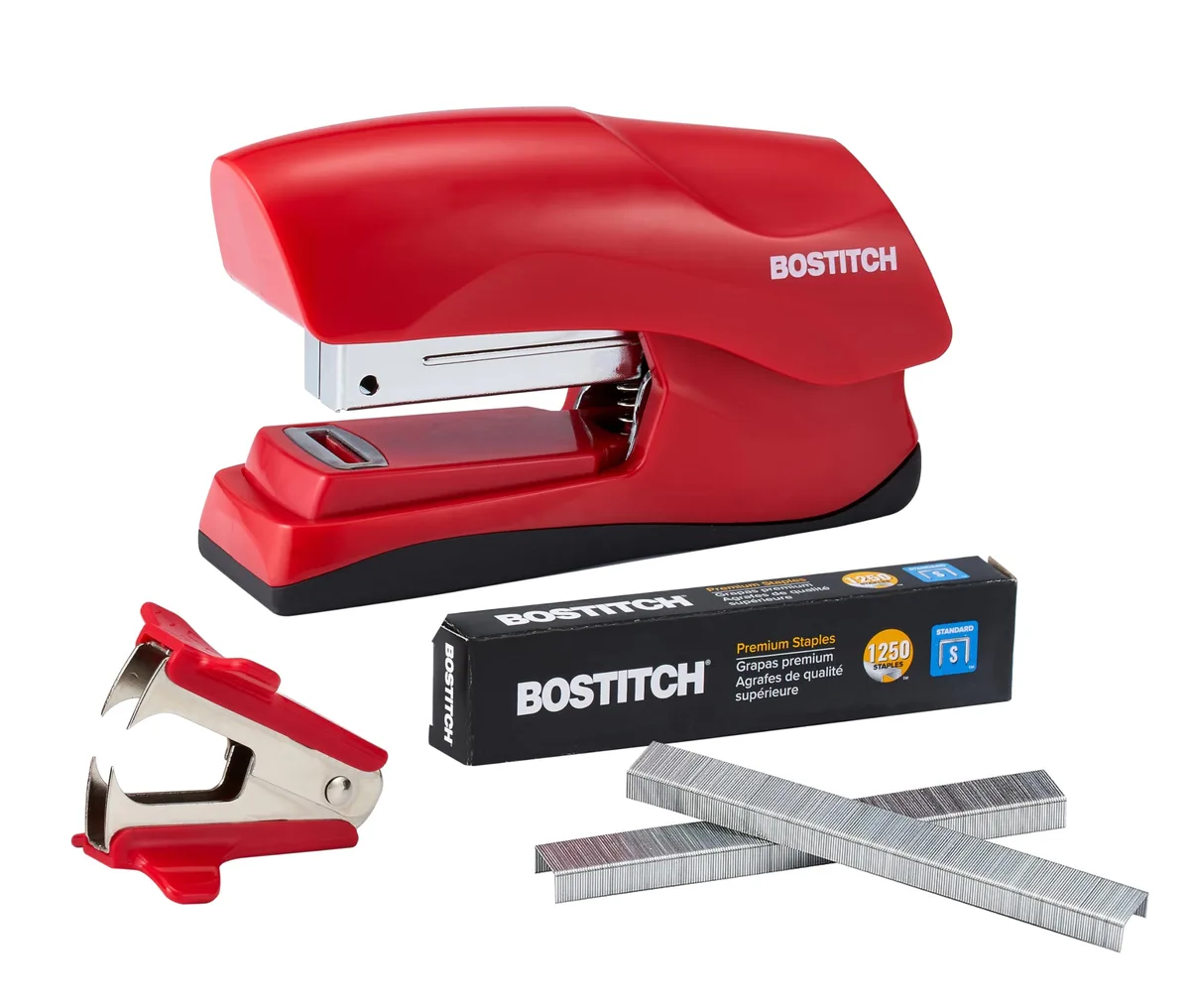 Red compact desktop stapler with rubber base and removable staple tray, shown with included staple remover