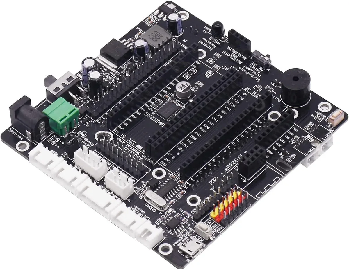 Green rectangular circuit board with pin headers, screw terminals and modular sensor sockets